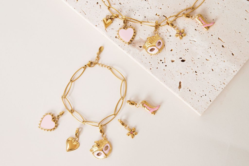 Gold charm bracelet with detachable pink heart, mask, boot pendants – B2B customizable jewelry for brands