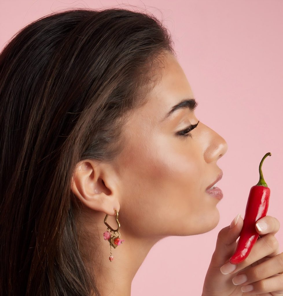 Heart-shaped hoop earrings with beaded pendants and charms